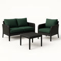 Gartenmöbelset aus Polyrattan in Schwarz mit dunkelgrünen Kissen, Sofa, Sessel und Tisch